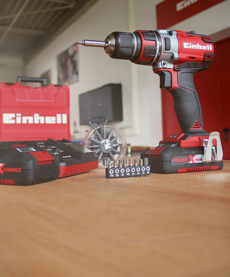 A picture of an Einhell cordless screwdriver with various accessories.