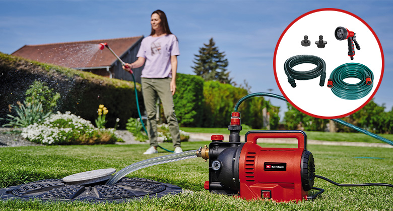 eine Frau bewässert den Rasen mithilfe einer Einhell Gartenpumpe