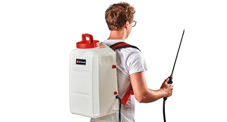man working with cordless pressure sprayer