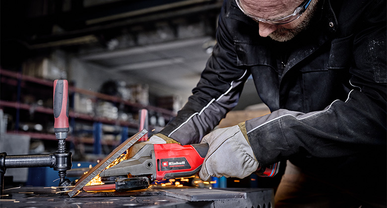 Precise grinding work on metal with a flat-head angle grinder.