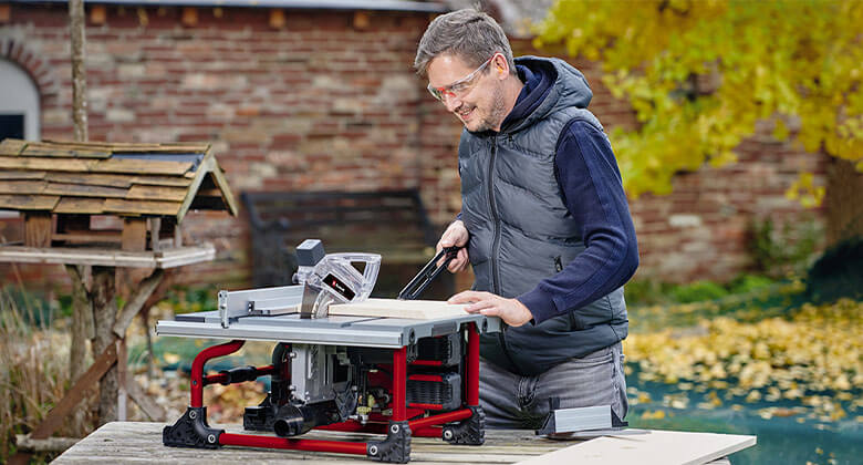 man working with a cordless table saw