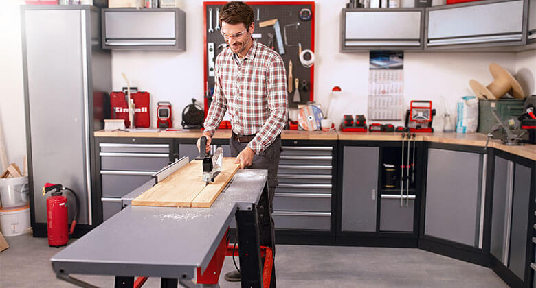 man showing parallel and angle stop of a table saw