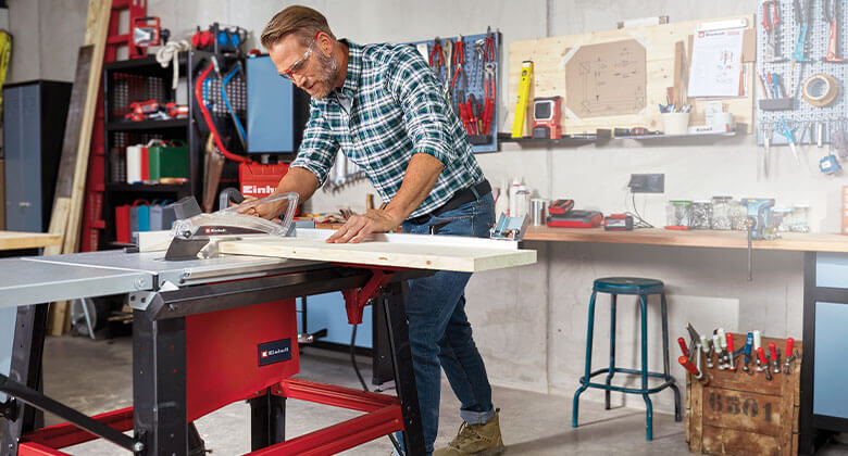 man with a table saw in side perspective
