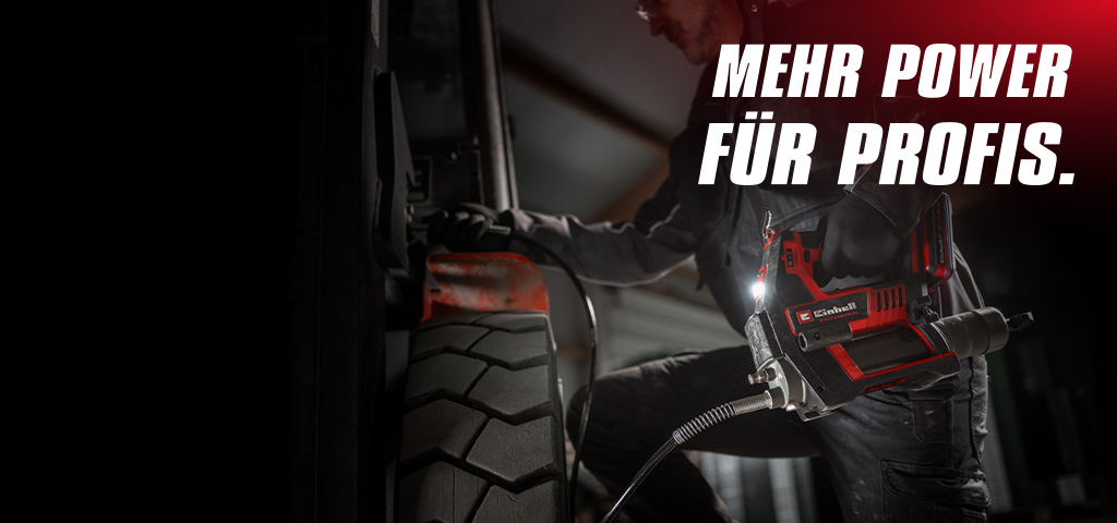 Person bei der Arbeit an einem Fahrzeug mit einem Einhell Werkzeug. Text im Bild: „MEHR POWER FÜR PROFIS.“